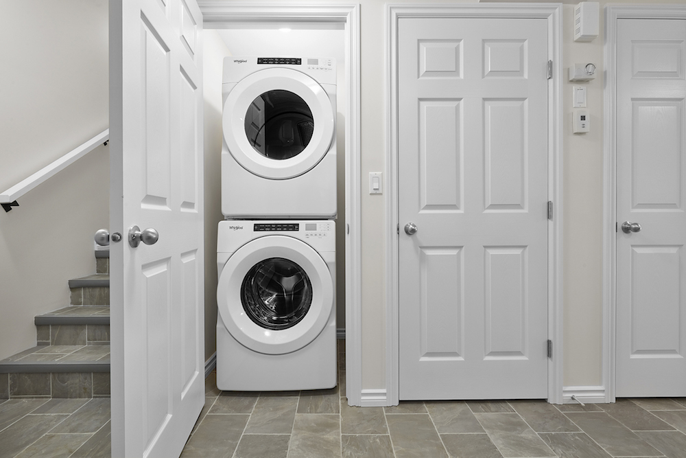 steps down to a basement suite with washer dryer